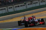 VALENCIA, SPAIN - FEBRUARY 03:  Jenson Button of Great Britain and McLaren Mercedes leads from Fernando Alonso of Spain and Ferrari during winter testing at the Ricardo Tormo Circuit on February 3, 2010 in Valencia, Spain.  (Photo by Ker Robertson/Getty Images)