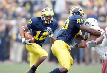 ANN ARBOR, MI - NOVEMBER 21: Roy Roundtree #12 of the Michigan Wolverines carries the ball during the game against the Ohio State Buckeyes on November 21, 2009 at Michigan Stadium in Ann Arbor, Michigan. Ohio State won the game 21-10. (Photo by Gregory Shamus/Getty Images)