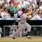 DENVER - AUGUST 13: Andrew McCutchen #22 of the Pittsburgh Pirates hits a run-scoring sacrifice fly in the fifth inning against the Colorado Rockies at Coors Field on August 13, 2009 in Denver, Colorado. (Photo by Doug Pensinger/Getty Images)