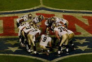 MIAMI GARDENS, FL - FEBRUARY 07: Drew Brees #9 of the New Orleans Saints talks to his team in the huddle against the Indianapolis Colts during Super Bowl XLIV on February 7, 2010 at Sun Life Stadium in Miami Gardens, Florida. (Photo by Scott Boehm/Getty Images)