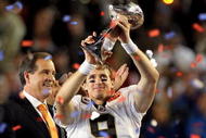 MIAMI GARDENS, FL - FEBRUARY 07:  Drew Brees #9 of the New Orleans Saints celebrates with the Vince Lombardi trophy at the end of Super Bowl XLIV on February 7, 2010 at Sun Life Stadium in Miami Gardens, Florida. The Saints defeated the Colts 31-17.  (Photo by Ezra Shaw/Getty Images)