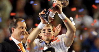 MIAMI GARDENS, FL - FEBRUARY 07:  Drew Brees #9 of the New Orleans Saints celebrates with the Vince Lombardi trophy at the end of Super Bowl XLIV on February 7, 2010 at Sun Life Stadium in Miami Gardens, Florida. The Saints defeated the Colts 31-17.  (Photo by Ezra Shaw/Getty Images)