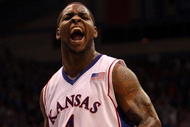 LAWRENCE, KS - FEBRUARY 06: Sherron Collins #4 of the Kansas Jayhawks reacts after scoring during the game against the Nebraska Cornhuskers on February 6, 2010 at Allen Fieldhouse in Lawrence, Kansas. (Photo by Jamie Squire/Getty Images)