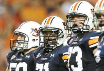 AUBURN, AL - SEPTEMBER 20:  Offensive lineman Ryan Pugh #50, Tyronne Green #71, Lee Ziemba #73 and tight end Tommy Trott #5 of the Auburn Tigers prepare for a play while taking on the LSU Tigers at Jordan-Hare Stadium on September 20, 2008 in Auburn, Alabama. LSU defeated Auburn 26-21.  (Photo by Doug Benc/Getty Images)