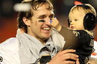 MIAMI GARDENS, FL - FEBRUARY 07:  Drew Brees #9 of the New Orleans Saints celebrates with his son Baylen Brees after defeating the Indianapolis Colts during Super Bowl XLIV on February 7, 2010 at Sun Life Stadium in Miami Gardens, Florida.  (Photo by Ronald Martinez/Getty Images)