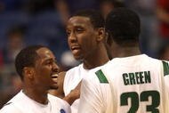 MINNEAPOLIS - MARCH 22:  (L-R) Kalin Lucas #1, Raymar Morgan #2 and Draymond Green #23 of the Michigan State Spartans celebrate after their 74-69 win against the USC Trojans during the second round of the NCAA Division I Men's Basketball Tournament at the Hubert H. Humphrey Metrodome on March 22, 2009 in Minneapolis, Minnesota.  (Photo by Jonathan Daniel/Getty Images)