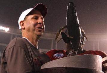 SAN DIEGO - DECEMBER 30:  Head Coach Bo Pelini of the University of Nebraska Cornhuskers receives the trophy after defeating the University of Arizona Wildcats in the Pacific Life Holiday Bowl on December 30, 2009 at Qualcomm Stadium in San Diego, California. The Cornhuskers defeated the Wildcats 33-0. (Photo By Donald Miralle/Getty Images)