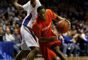 ROSEMONT, IL - JANUARY 30: Wes Johnson #4 of the Syracuse Orange drives around Mike Stovall #1 of the DePaul Blue Demons at the Allstate Arena on January 30, 2010 in Rosemont, Illinois. Syracuse defeated DePaul 59-57. (Photo by Jonathan Daniel/Getty Images)