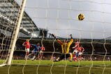 LONDON, ENGLAND - FEBRUARY 07:  Didier Drogba of Chelsea shoots and scores the second goal of the game by kissing his badge during the Barclays Premier League match between Chelsea and Arsenal at Stamford Bridge on February 7, 2010 in London, England.  (Photo by Paul Gilham/Getty Images)