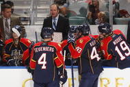 SUNRISE, FL - FEBRUARY 5: Head coach Peter DeBoer diagrams a play for Dennis Seidenberg #4  and Dmitry Kulikov #43 of the Florida Panthers during a time out late in the third period against the Calgary Flames on February 5, 2010 at the BankAtlantic Center in Sunrise, Florida. The Flames defeated the Panthers 2-1. (Photo by Joel Auerbach/Getty Images)