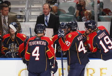 SUNRISE, FL - FEBRUARY 5: Head coach Peter DeBoer diagrams a play for Dennis Seidenberg #4  and Dmitry Kulikov #43 of the Florida Panthers during a time out late in the third period against the Calgary Flames on February 5, 2010 at the BankAtlantic Center in Sunrise, Florida. The Flames defeated the Panthers 2-1. (Photo by Joel Auerbach/Getty Images)