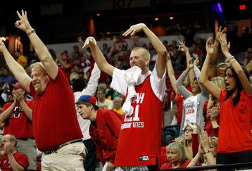 LAS VEGAS - MARCH 13:  Utah Utes fans (L-R) Brett Green, Corbin Green and Chelsie Lodder cheer during a semifinal game of the Conoco Mountain West Conference Basketball Championships at the Thomas & Mack Center March 13, 2009 in Las Vegas, Nevada. The Utes won 68-55.  (Photo by Ethan Miller/Getty Images)