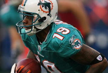 EAST RUTHERFORD, NJ - NOVEMBER 01:  Ted Ginn #19 of the Miami Dolphins returns a kick off during a game against the New York Jets at Giants Stadium on November 1, 2009 in East Rutherford, New Jersey.  (Photo by Chris Trotman/Getty Images)