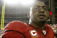 GLENDALE, AZ - JANUARY 10: Linebacker Karlos Dansby #58 of the Arizona Cardinals walks off the field after defeating the Green Bay Packers 51-45 in the 2010 NFC wild-card playoff game at University of Phoenix Stadium on January 10, 2010 in Glendale, Arizona. (Photo by Jeff Gross/Getty Images)