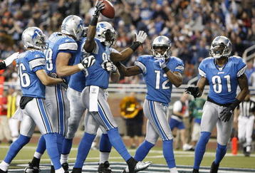 DETROIT - JANUARY 03: Bryant Johnson #80 of the Detroit Lions celebrates a second quarter touchdown with Calvin Johnson #81 and Derrick Williams #12 while playing the Chicago Bears on January 3, 2010 at Ford Field in Detroit, Michigan.  (Photo by Gregory Shamus/Getty Images)