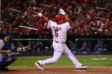 ST. LOUIS, MO - OCTOBER 10:  Albert Pujols #5 of the St. Louis Cardinals hits an RBIsingle against the Los Angeles Dodgers in the eighth inning of Game Three of the NLDS during the 2009 MLB Playoffs at Busch Stadium on October 10, 2009 in St. Louis, Missouri. (Photo by Dilip Vishwanat/Getty Images)