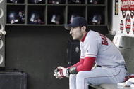 OAKLAND, CA - OCTOBER 6: Nomar Garciaparra #5 of the Boston Red Sox sits in the dugout as he gets ready for the start of Game 5 of the 2003 American League Divisional Series against the Oakland A's on October 6, 2003 at Network Associates Coliseum in Oakland, California. The Red Sox defeated the A's 4-3. (Photo by Jed Jacobsohn/Getty Images)