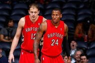 ATLANTA - DECEMBER 02: Sonny Weems #24 and Rasho Nesterovic #12 of the Toronto Raptors against the Atlanta Hawks at Philips Arena on December 2, 2009 in Atlanta, Georgia. NOTE TO USER: User expressly acknowledges and agrees that, by downloading and/or using this Photograph, User is consenting to the terms and conditions of the Getty Images License Agreement. (Photo by Kevin C. Cox/Getty Images)