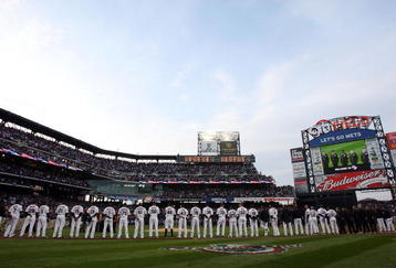 NEW YORK - APRIL 13:  The New York Mets line up during pre game ceremonies prior to playing the San Diego Padres on April 13, 2009 at Citi Field in the Flushing neighborhood of the Queens borough of New York City.This is the first regular season MLB game being played at the new venue which replaced Shea Stadium as the Mets home field.  (Photo by Jim McIsaac/Getty Images)