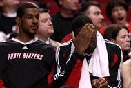 PORTLAND, OR - APRIL 18:  LaMarcus Aldridge (L) #12, Greg Oden (C) #52 and Rudy Fernandez (R) #5 of the Portland Trail Blazers watch the game from the bench against the Houston Rockets during Game 1 of the Western Conference Quarterfinals of the NBA Playoffs on April 18, 2009 at the Rose Garden in Portland, Oregon. NOTE TO USER: User expressly acknowledges and agrees that, by downloading and or using this Photograph, user is consenting to the terms and conditions of the Getty Images License Agreement.  (Photo by Jonathan Ferrey/Getty Images)