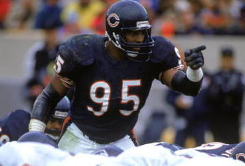 CHICAGO - NOVEMBER 11:  Defensive end Richard Dent #95 of the Chicago Bears points as he looks over the Atlanta Falcons offense during game at Soldier Field on November 11, 1990 in Chicago, Illinois.  The Bears won 30-24.  (Photo by Jonathan Daniel/Getty Images)
