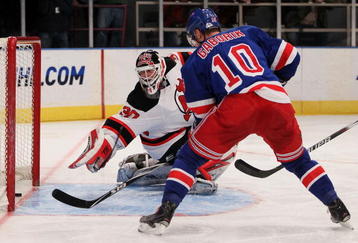 NEW YORK - FEBRUARY 06: Marian Gaborik #10 of the New York Rangers shoots a goal past goalkeeper Martin Brodeur #30 of the New Jersey Devils during their game on February 6, 2010 at Madison Square Garden in New York City.  (Photo by Chris McGrath/Getty Images)