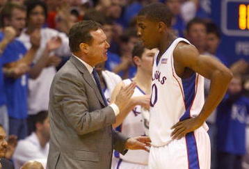 LAWRENCE, KS - DECEMBER 22: Head coach Bill Self of the Kansas Jayhawks talks to Tyshawn Taylor #10 during the game against the California Golden Bears on December 22, 2009 at Allen Fieldhouse in Lawrence, Kansas. (Photo by Jamie Squire/Getty Images)