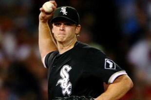BOSTON - AUGUST 26:  Starting pitcher Gavin Floyd #34 of the Chicago White Sox throws to first base during the sixth inning during the game against the Boston Red Sox on August 26, 2009 at Fenway Park in Boston, Massachusetts. (Photo by: Elsa/Getty Images)