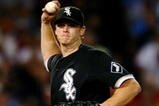 BOSTON - AUGUST 26:  Starting pitcher Gavin Floyd #34 of the Chicago White Sox throws to first base during the sixth inning during the game against the Boston Red Sox on August 26, 2009 at Fenway Park in Boston, Massachusetts. (Photo by: Elsa/Getty Images)