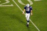MIAMI GARDENS, FL - FEBRUARY 07:  Peyton Manning #18 of the Indianapolis Colts reacts as he walks off the field against the New Orleans Saints during Super Bowl XLIV on February 7, 2010 at Sun Life Stadium in Miami Gardens, Florida.  (Photo by Doug Benc/Getty Images)