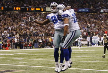 NEW ORLEANS - DECEMBER 19:  (R-L) Miles Austin #19 of the Dallas Cowboys reacts after his 49-yard touchdown with Kevin Ogletree #85 in the first quarter against the New Orleans Saints at the Louisiana Superdome on December 19, 2009 in New Orleans, Louisiana.  (Photo by Chris Graythen/Getty Images)