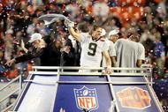 MIAMI GARDENS, FL - FEBRUARY 07: Drew Brees #9 of the New Orleans Saints celebrates after defeating the Indianapolis Colts during Super Bowl XLIV on February 7, 2010 at Sun Life Stadium in Miami Gardens, Florida. (Photo by Jed Jacobsohn/Getty Images)