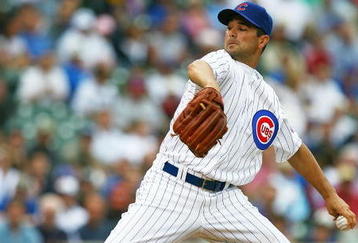 CHICAGO - AUGUST 28: Starting pitcher Ted Lilly #30 of the Chicago Cubs delivers the ball against the New York Mets on August 28, 2009 at Wrigley Field in Chicago, Illinois. The Cubs defeated the Mets 5-2.  (Photo by Jonathan Daniel/Getty Images)