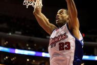 LOS ANGELES, CA - JANUARY 18: Marcus Camby #23 of the Los Angeles Clippers dunks against the the New Jersey Nets on January 18, 2010 at Staples Center in Los Angeles, California. The Clippers won 106-95. NOTE TO USER: User expressly acknowledges and agrees that, by downloading and/or using this Photograph, user is consenting to the terms and conditions of the Getty Images License Agreement. (Photo by Stephen Dunn/Getty Images)