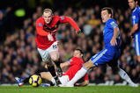 LONDON, ENGLAND - NOVEMBER 08:  Wayne Rooney of Manchester United goes past the challenge from John Terry of Chelsea during the Barclays Premier League match between Chelsea and Manchester United at Stamford Bridge on November 8, 2009 in London, England.  (Photo by Clive Mason/Getty Images)