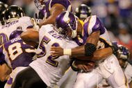 MINNEAPOLIS - OCTOBER 18:  Linebacker Ray Lewis #52 of the Baltimore Ravens makes a tackle on running back Adrian Peterson #28 of the Minnesota Vikings on first and goal from the two in the fourth quarter during NFL action at Hubert H. Humphrey Metrodome on October 18, 2009 in Minneapolis, Minnesota. The Vikings defeated the Ravens 33-31.  (Photo by Doug Pensinger/Getty Images)