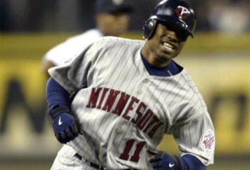 SEATTLE - APRIL 5:  Jacque Jones #11 of the Minnesota Twins rounds third base after hitting a two run homer in the fifth inning against the Seattle Mariners on April 5, 2005 at Safeco Field in Seattle, Washington.  (Photo by Otto Greule Jr/Getty Images)