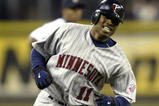 SEATTLE - APRIL 5:  Jacque Jones #11 of the Minnesota Twins rounds third base after hitting a two run homer in the fifth inning against the Seattle Mariners on April 5, 2005 at Safeco Field in Seattle, Washington.  (Photo by Otto Greule Jr/Getty Images)