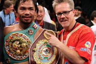 LAS VEGAS - NOVEMBER 14: Manny Pacquiao celebrates his 12 round TKO victory against Miguel Cotto with trainer Freddy Roach during their WBO welterweight title fight at the MGM Grand Garden Arena on November 14, 2009 in Las Vegas, Nevada. (Photo by Al Bello/Getty Images)