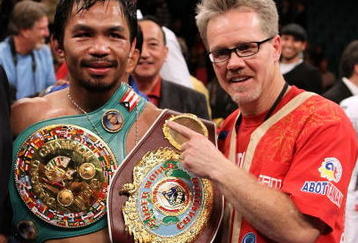 LAS VEGAS - NOVEMBER 14:  Manny Pacquiao celebrates his 12 round TKO victory against Miguel Cotto with trainer Freddy Roach during their WBO welterweight title fight at the MGM Grand Garden Arena on November 14, 2009 in Las Vegas, Nevada.  (Photo by Al Bello/Getty Images)