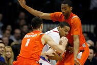 ROSEMONT, IL - JANUARY 30: Mike Stovall #1 of the DePaul Blue Demons tries to control the ball under pressure from Andy Rautins #1 and Wes Johnson #4 of the Syracuse Orange at the Allstate Arena on January 30, 2010 in Rosemont, Illinois. Syracuse defeated DePaul 59-57. (Photo by Jonathan Daniel/Getty Images)
