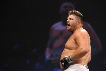 UNCASVILLE, CT - MAY 16: Roy Nelson (White Trunks) of the Lions Den celebrates after beating Brad Imes MilesTech Fighting System during their bout presented by the International Fighting League at the Mohegan Sun Arena May 16, 2008 in Uncasville, Connecticut.  (Photo by Al Bello/Getty Images)