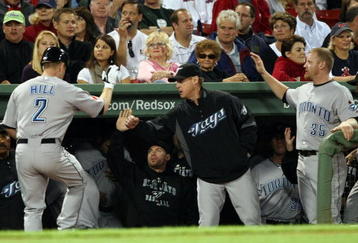 BOSTON - SEPTEMBER 28:  Aaron Hill #2 of the Toronto Blue Jays is congratulated by teammates after after his solo home run in the first inning against the Boston Red Sox on September 28, 2009 at Fenway Park in Boston, Massachusetts.  (Photo by Elsa/Getty Images)