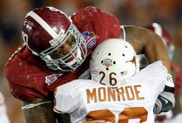 PASADENA, CA - JANUARY 07:  Lorenzo Washington #97 of the Alabama Crimson Tide tackles D.J. Monroe #26 of the Texas Longhorns during the Citi BCS National Championship game at the Rose Bowl on January 7, 2010 in Pasadena, California.  (Photo by Jeff Gross/Getty Images)