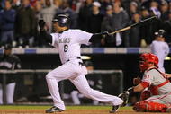 DENVER - OCTOBER 11: Yorvit Torrealba #8 of the Colorado Rockies hits a go ahead RBI double against the Philadelphia Phillies to give the Rockies a 4-2 lead in the bottom of the eighth inning in Game Four of the NLDS during the 2009 MLB Playoffs at Coors Field on October 12, 2009 in Denver, Colorado. (Photo by Doug Pensinger/Getty Images)