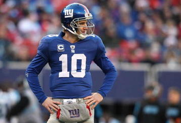 EAST RUTHERFORD, NJ - DECEMBER 27:  Eli Manning #10 of the New York Giants stands on the field  against the Carolina Panthers at Giants Stadium on December 27, 2009 in East Rutherford, New Jersey.  (Photo by Nick Laham/Getty Images)