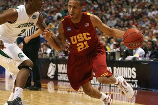 MINNEAPOLIS - MARCH 22:  Dwight Lewis #21 of the USC Trojans drives against Raymar Morgan #2 of the Michigan State Spartans during the second round of the NCAA Division I Men's Basketball Tournament at the Hubert H. Humphrey Metrodome on March 22, 2009 in Minneapolis, Minnesota.  (Photo by Jonathan Daniel/Getty Images)