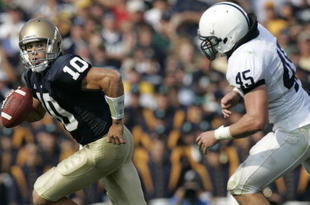 SOUTH BEND, IN - SEPTEMBER 9:  Brady Quinn #10 of the Notre Dame Fighting Irish runs from the pressure of Sean Lee #45 of the Penn State Nittany Lions on September 9, 2006 at Notre Dame Stadium in South Bend, Indiana.  (Photo by Gregory Shamus/Getty Images)