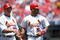 ST. LOUIS - JUNE 17:  Albert Pujols #5 of the St. Louis Cardinals is congratulated by teammate Mark McGwire #25 during the game against the Chicago White Sox at Busch Stadium on June 17, 2001 in St. Louis, Missouri. The Cardinals defeated the White Sox 8-3. (Photo by: Elsa/Getty Images)