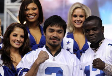 ARLINGTON, TX - JANUARY 19:  Manny Pacquiao and Joshua Clottey pose for photos with the Dallas Cowboys Cheerleaders at Cowboys Stadium on January 19, 2010 in Arlington, Texas.  (Photo by Ronald Martinez/Getty Images)